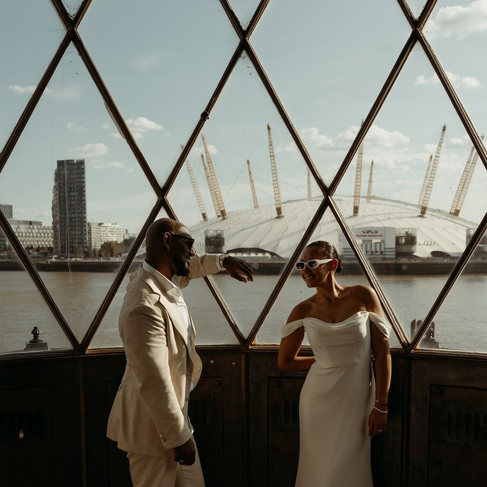 bride-and-groom-at-london-wedding-with-view-of-millenium-dome
