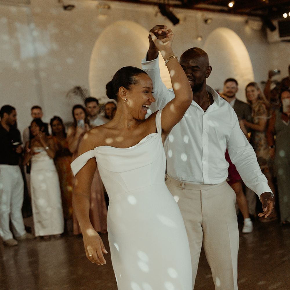 groom-spins-bride-around-for-first-dance