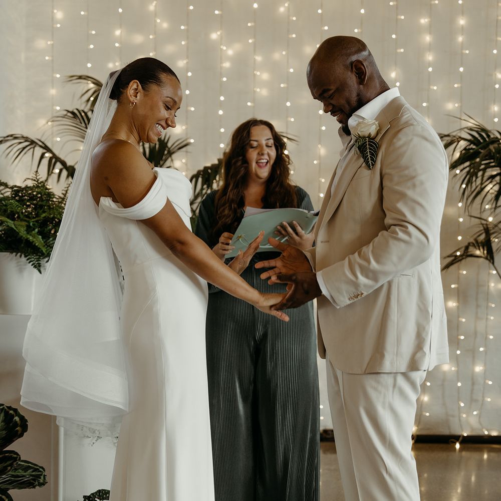 the-bride-and-groom-exchange-rings-at-humanist-wedding-ceremony