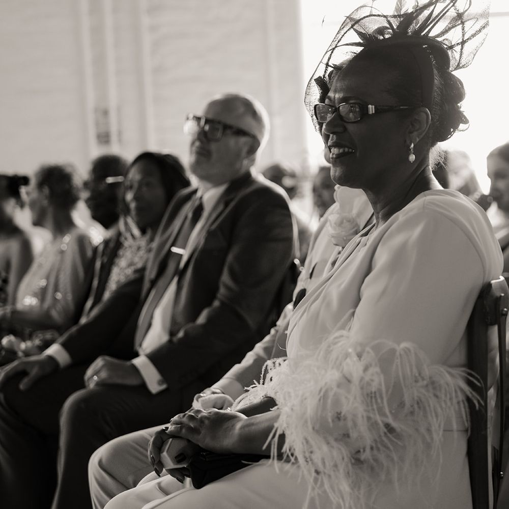 wedding-guest-wearing-feather-dress-at-wedding-ceremony