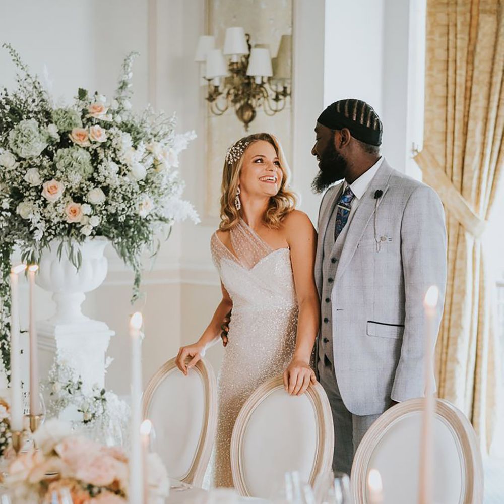 bride and groom with blush pink and peach wedding theme