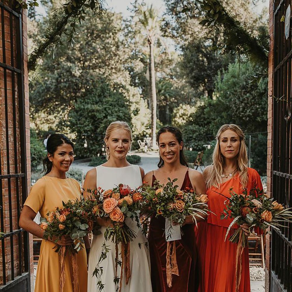 mismatched orange toned bridesmaid dresses