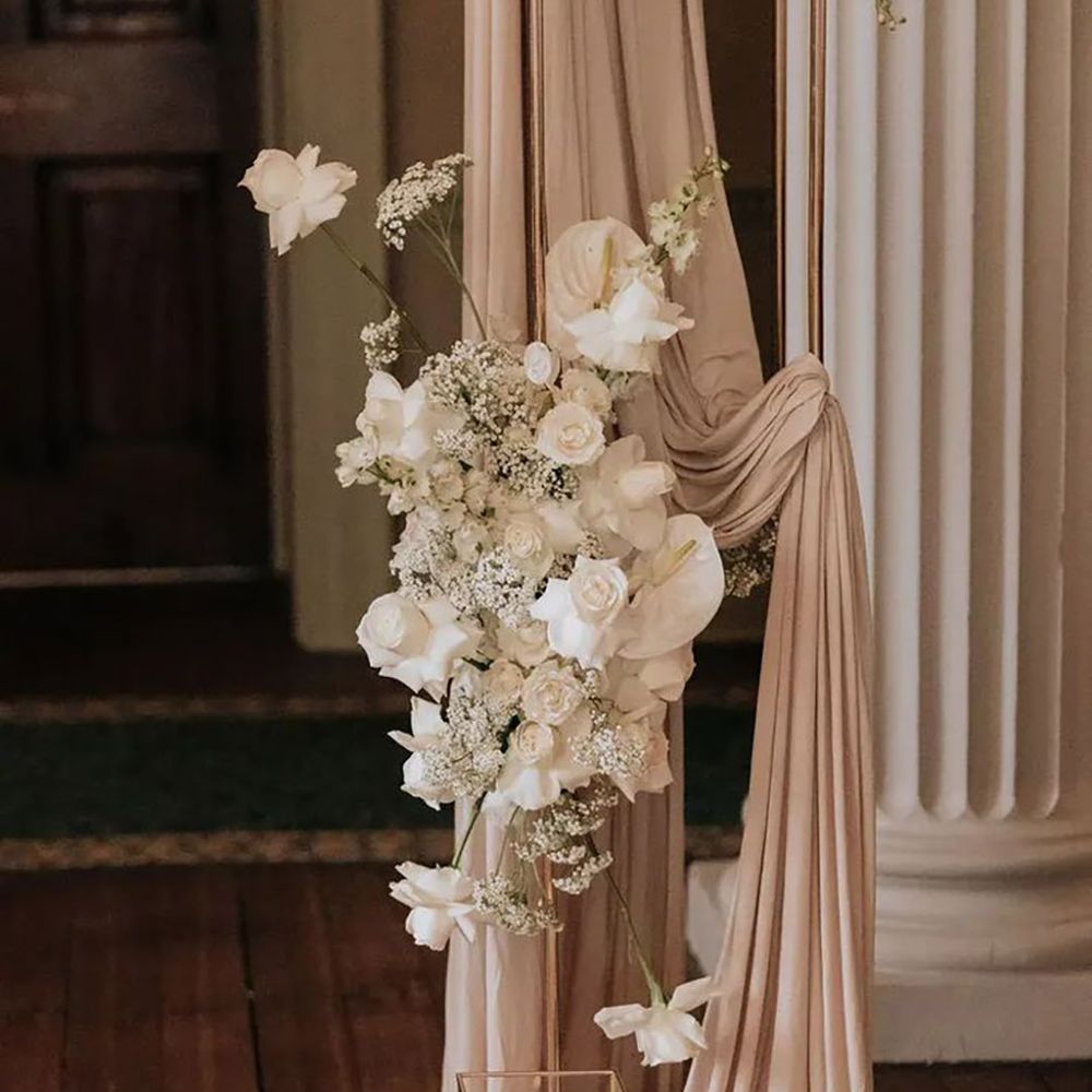 neutral wedding decor, including flowers and candles