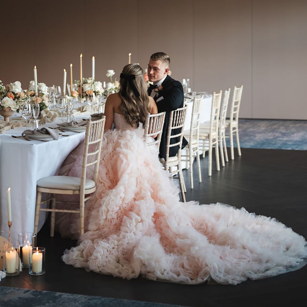 bride wearing statement peach tulle wedding dress