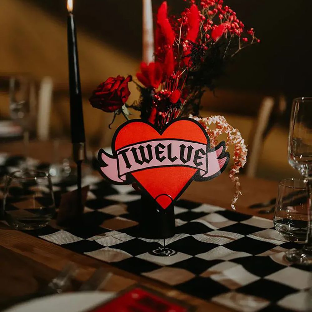 til death do us part red wedding sign as table decor