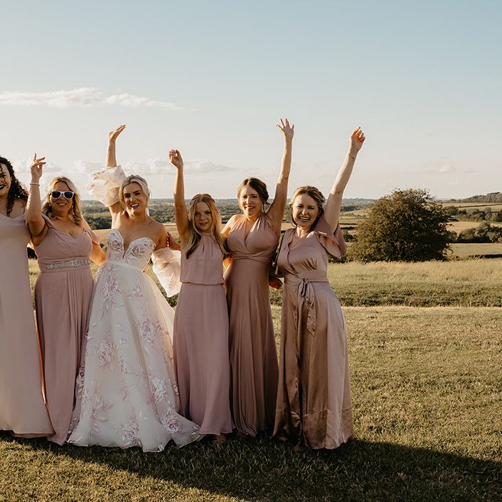 bridal-party-wearing-pink-bridesmaid-dresses