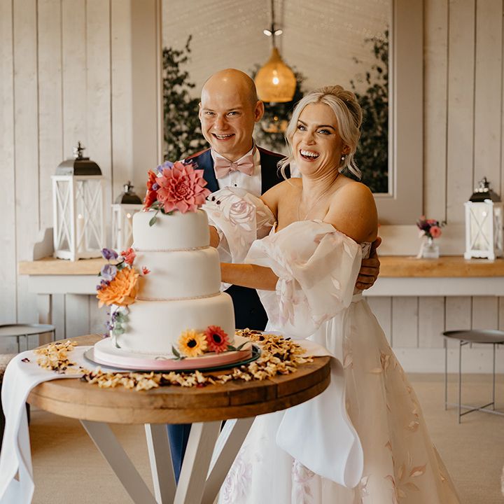 bride-and-groom-cut-wedding-cake
