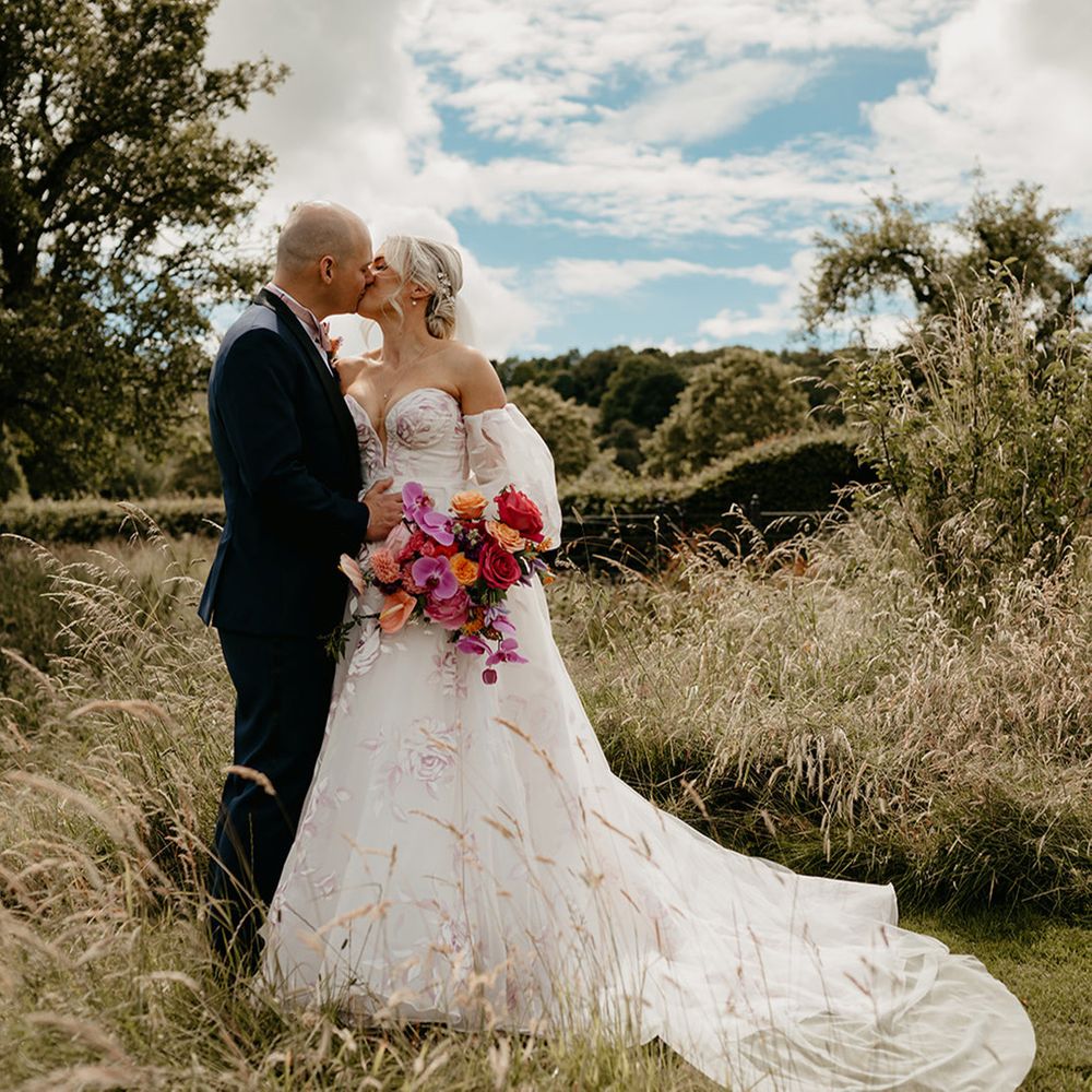 bride-in-bespoke-pink-flower-wedding-dress-with-groom