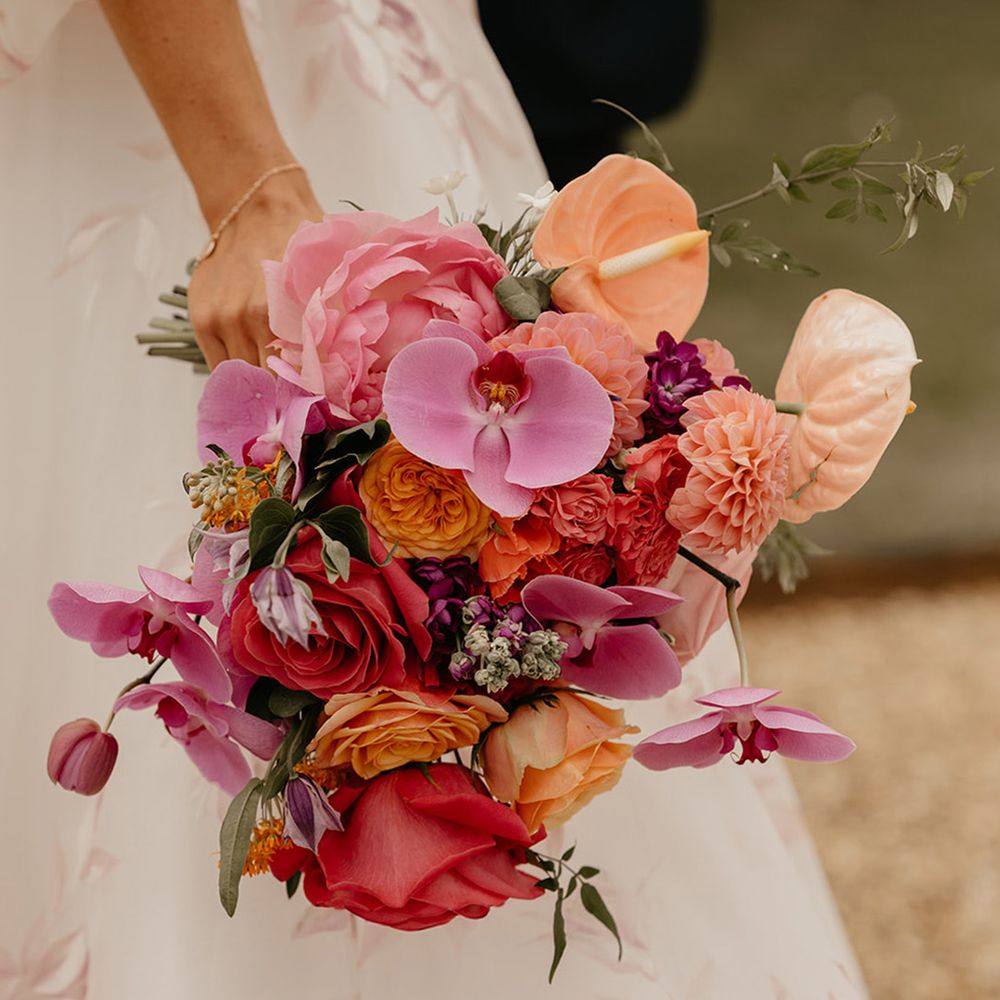 bright-pink-and-coral-wedding-bouquet-with-orchids-and-anthuriums