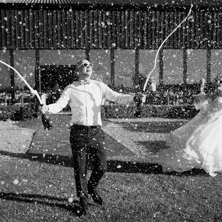 groom-sprays-champagne-at-wedding