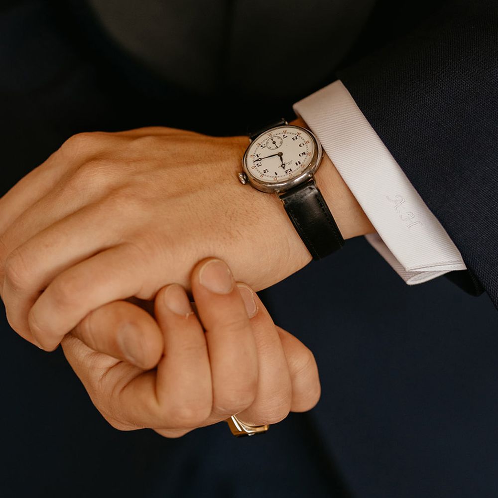 groom-wearing-classic-watch-with-leather-strap