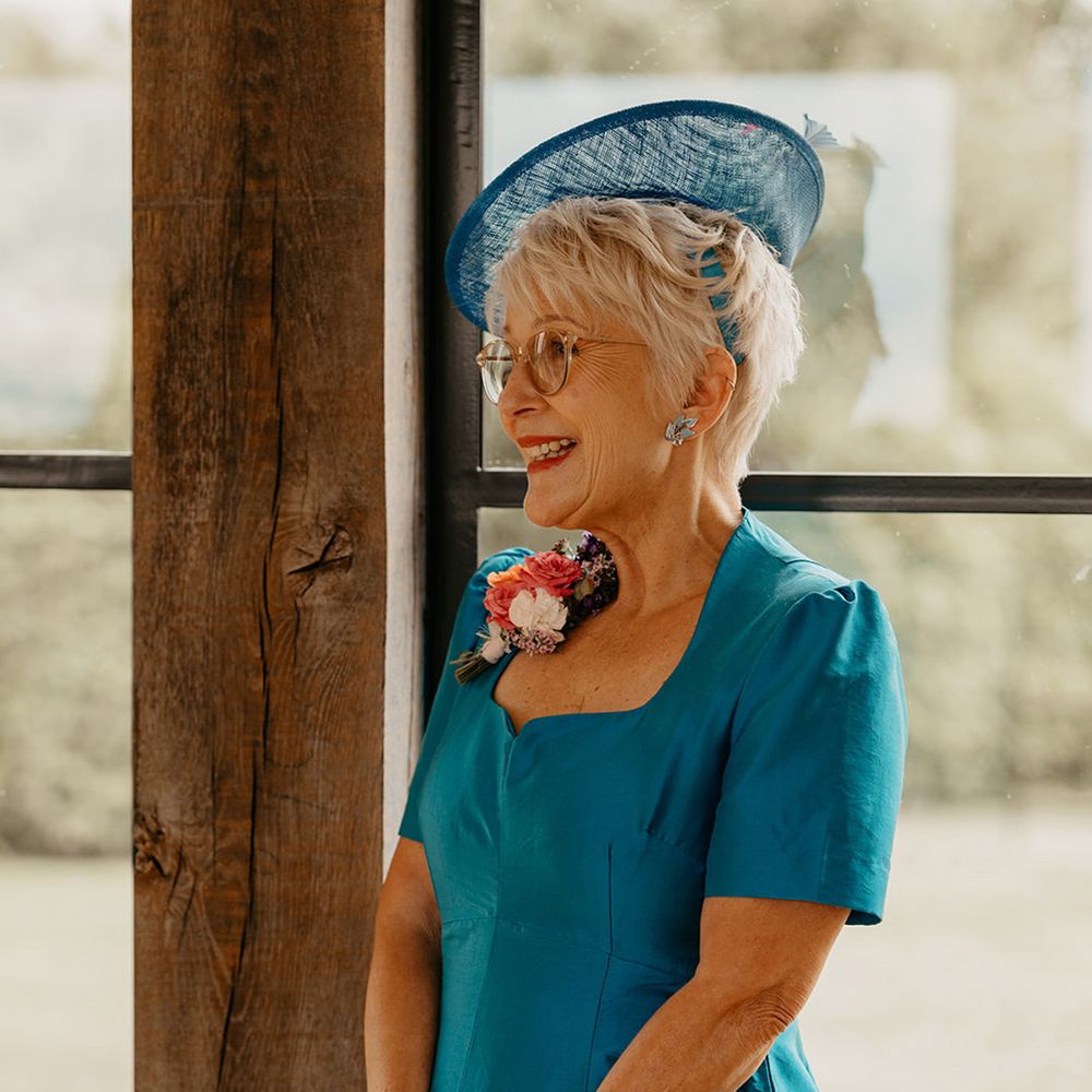 mother-of-the-bride-wearing-blue-dress-and-hat