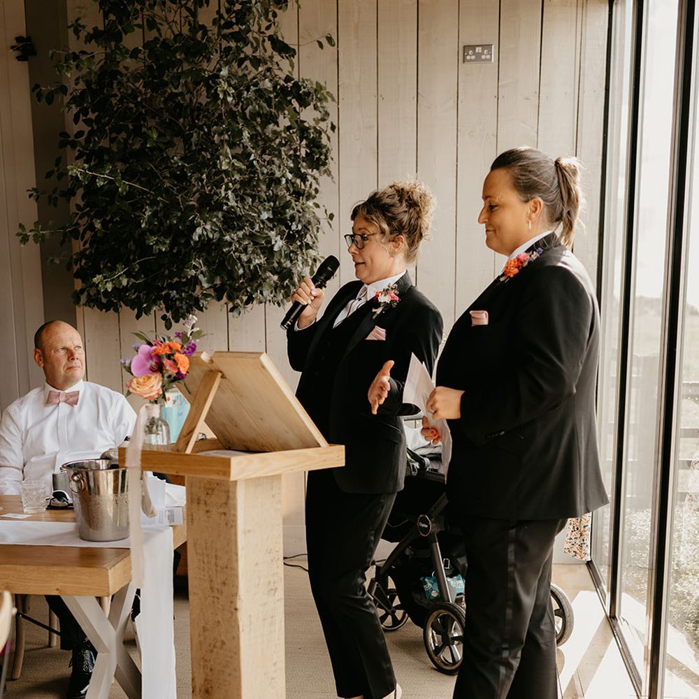 two-groomswomen-read-wedding-speech