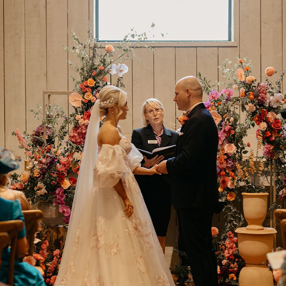 wedding-ceremony-at-primrose-hill-farm-with-colourful-flower-columns