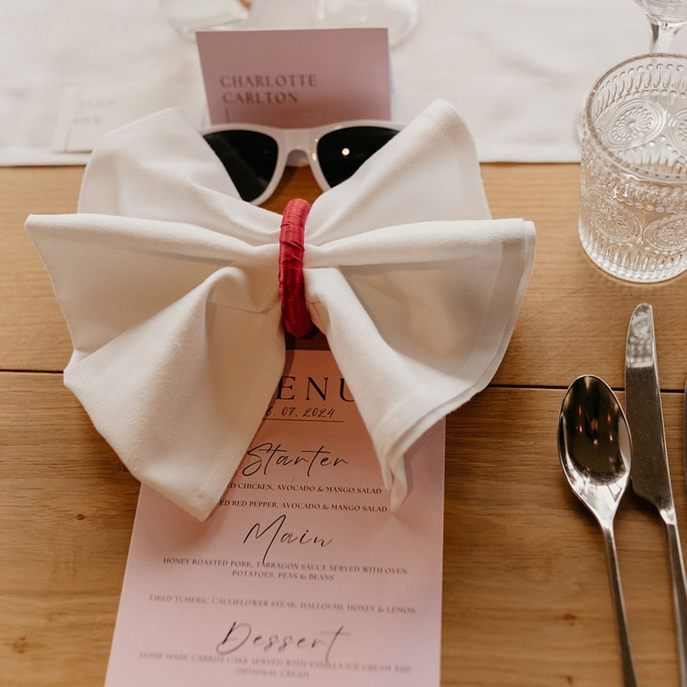 white-bow-napkin-pink-place-setting