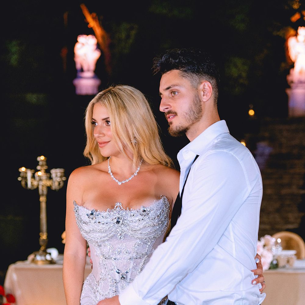 bride-in-glam-strapless-wedding-reception-gown-with-groom