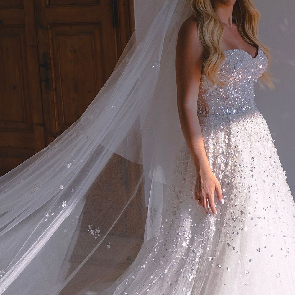 bride-wearing-sequin-strapless-wedding-dress-with-sparkly-veil