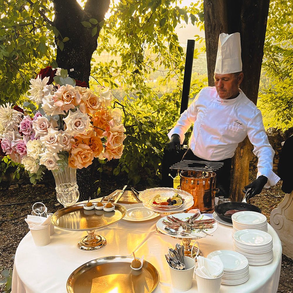 chef-serves-wedding-food-outdoors