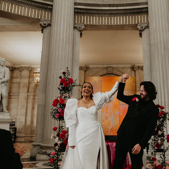 bride-and-groom-face-their-wedding-guests-as-they-are-announced-as-married-couple