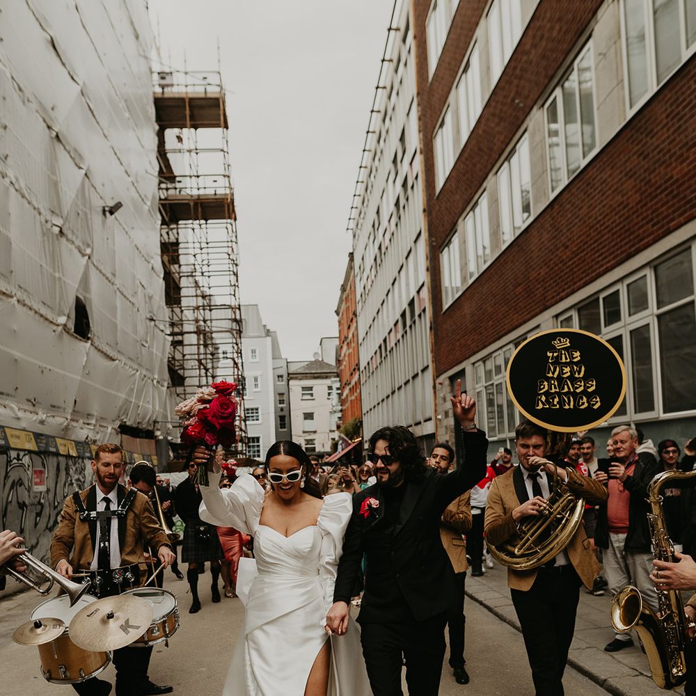 bride-and-groom-with-brass-band-on-streets-of-dublin