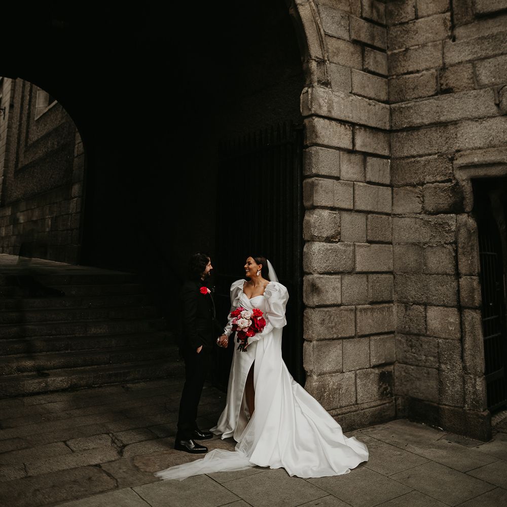 bride-in-princess-wedding-dress-with-groom-in-black-suit