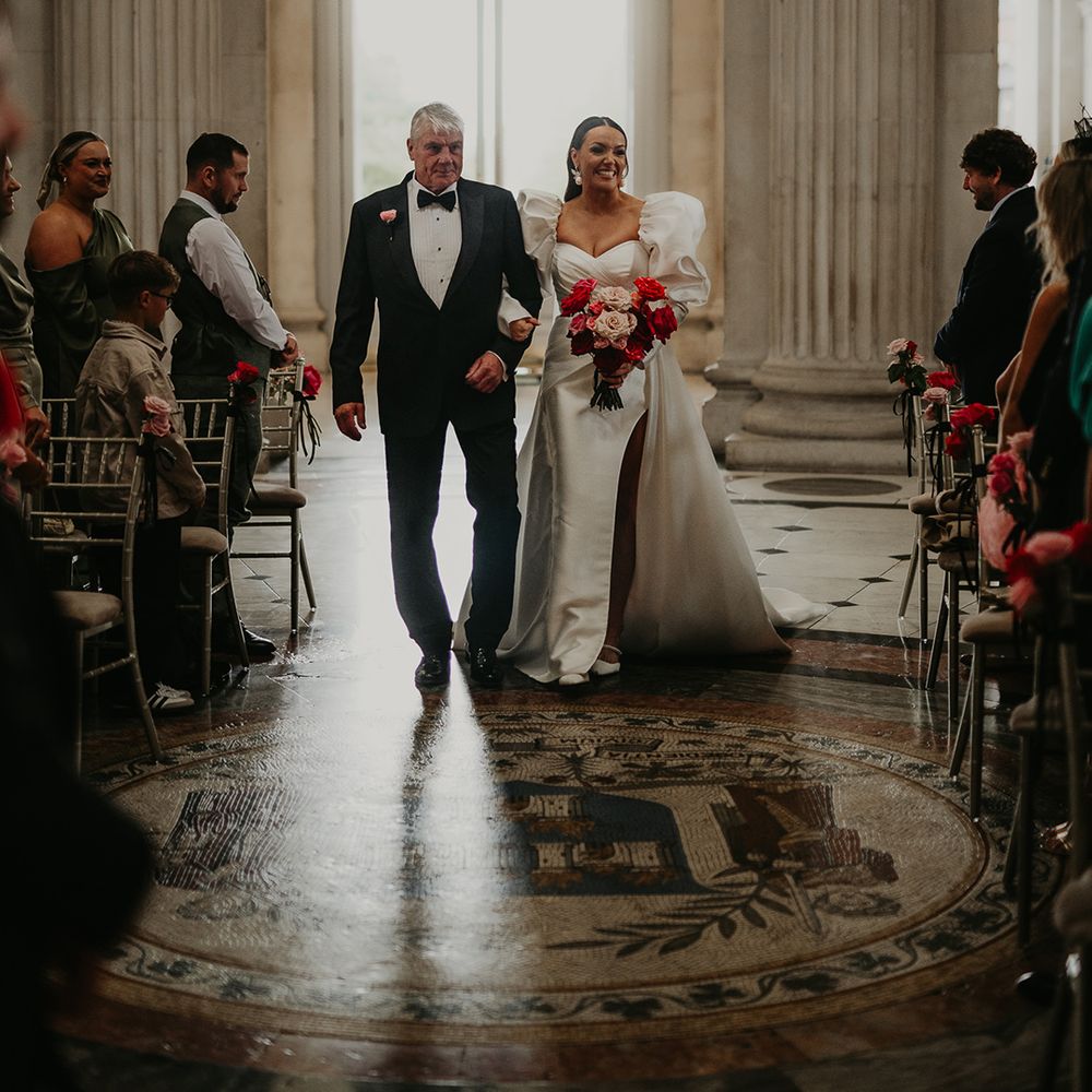 father-of-the-bride-in-black-tuxedo-walks-bride-down-the-aisle
