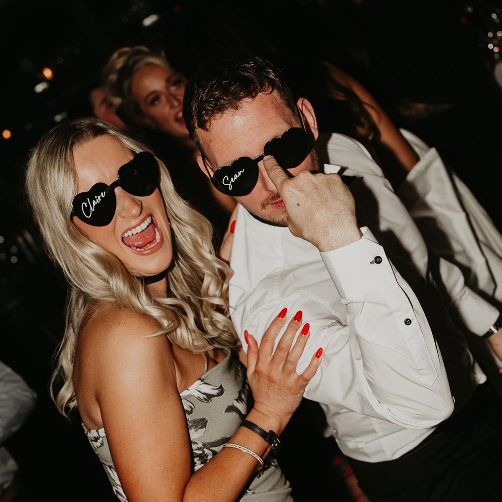 wedding-guests-wearing-personalised-wedding-sunglasses