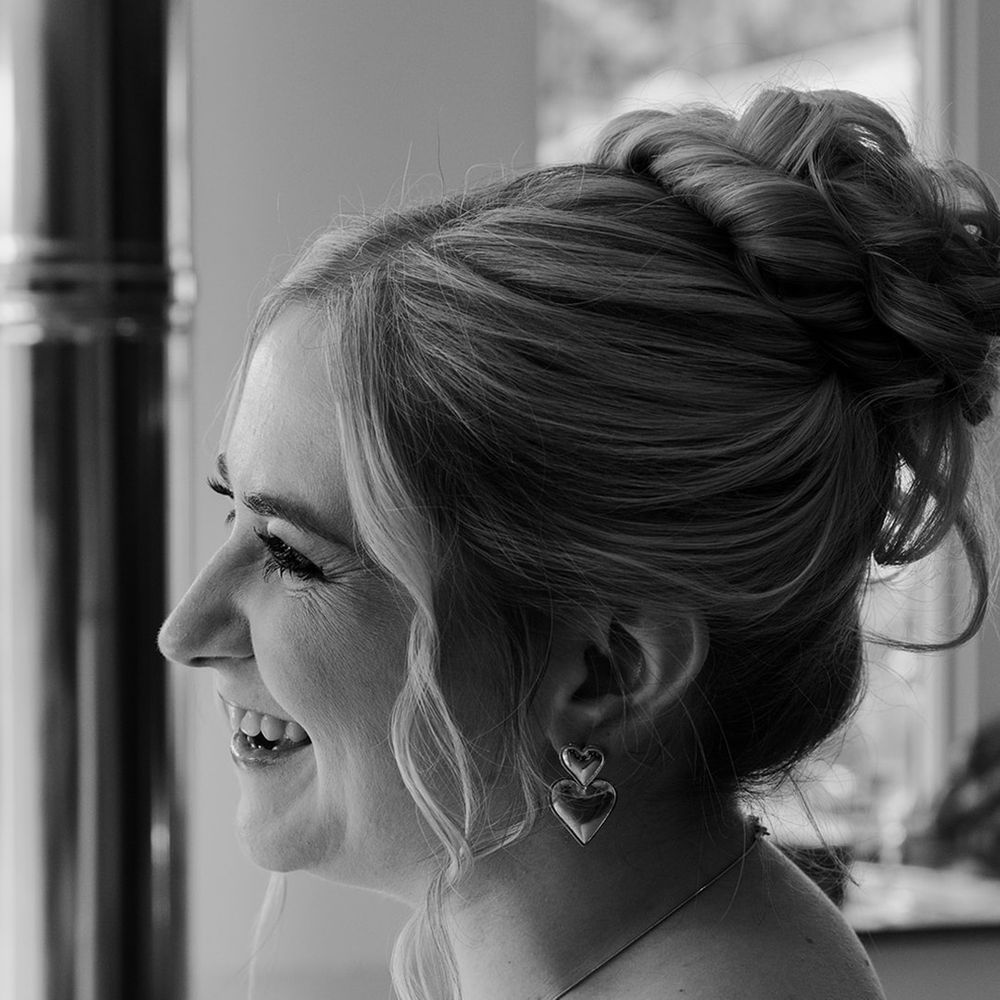 bridal-updo-hairstyle-with-heart-earrings