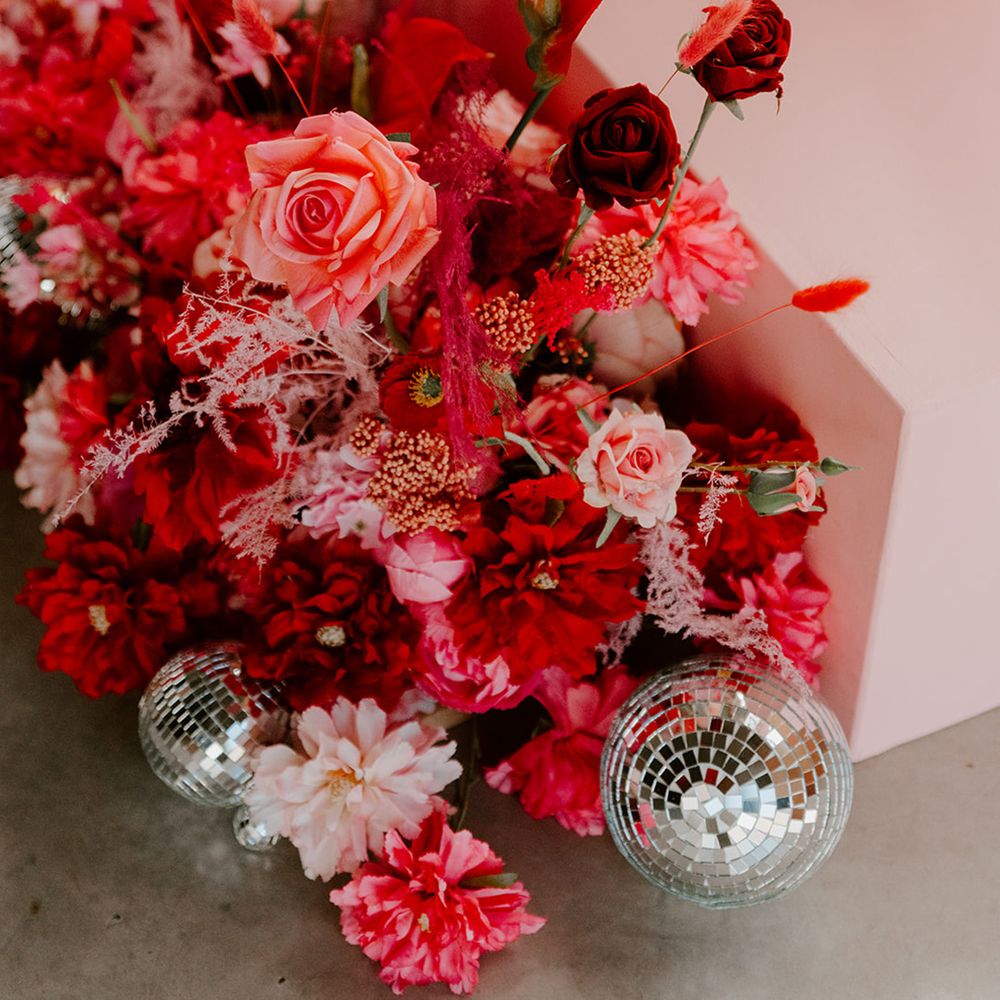 bright-pink-wedding-flower-arrangements-with-disco-ball