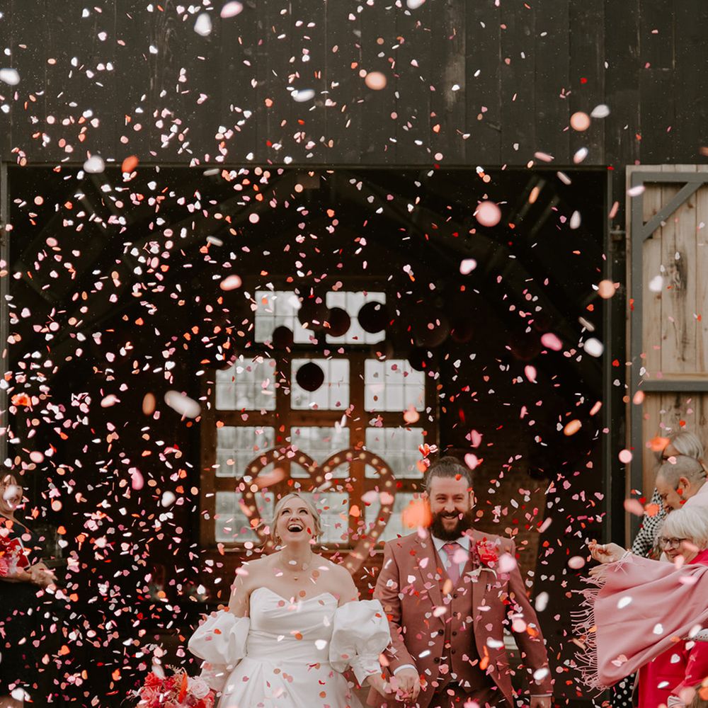 pink-confetti-moment-at-giraffe-shed-wedding