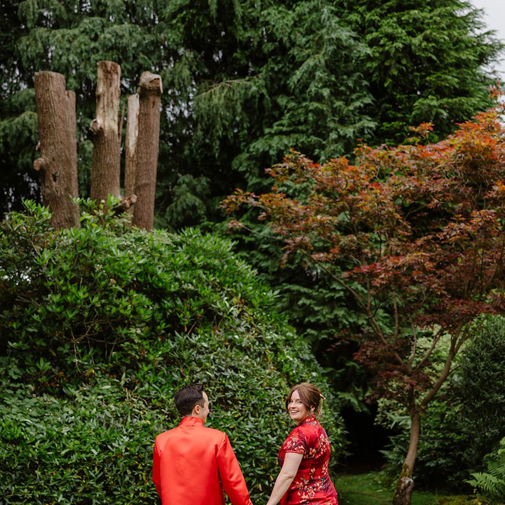 bride-and-groom-in-traditional-black-and-red-chinese-wedding-attire