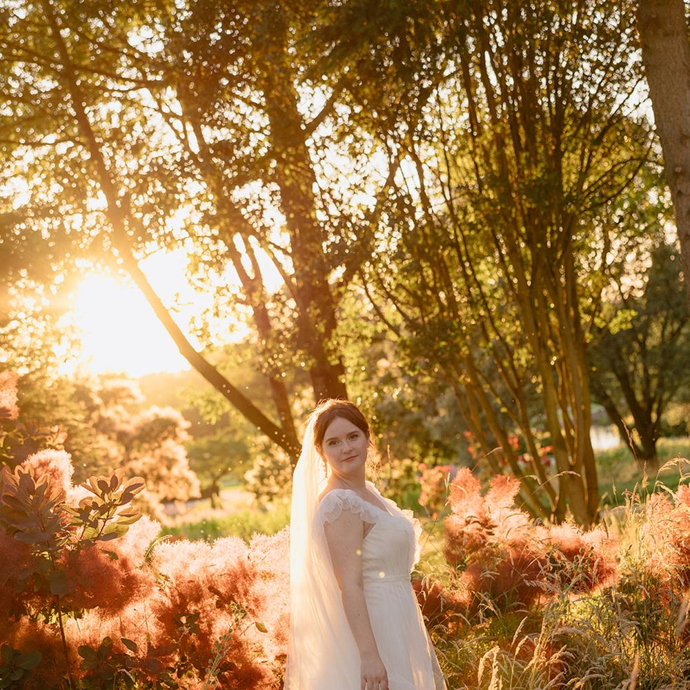 bride-in-ruffle-tulle-wedding-dress-during-golden-hour