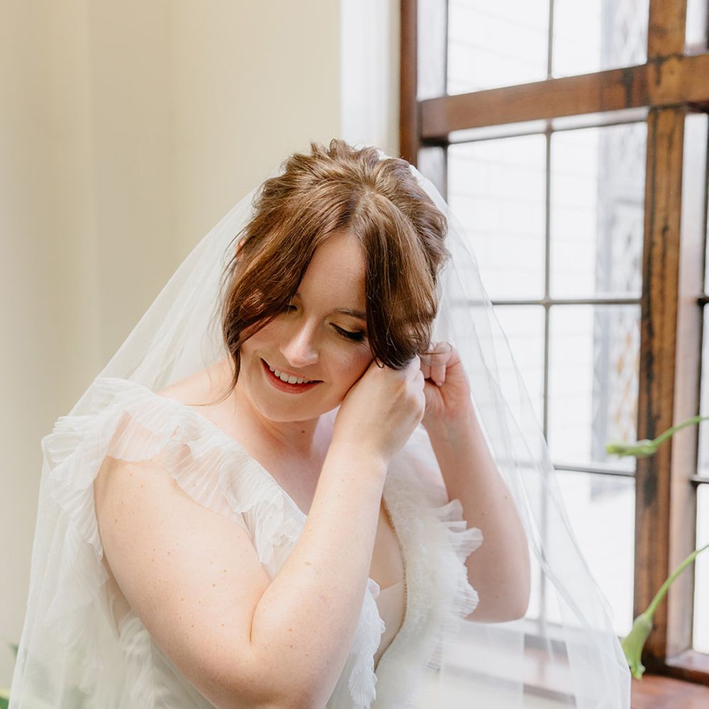 bride-puts-in-wedding-earrings