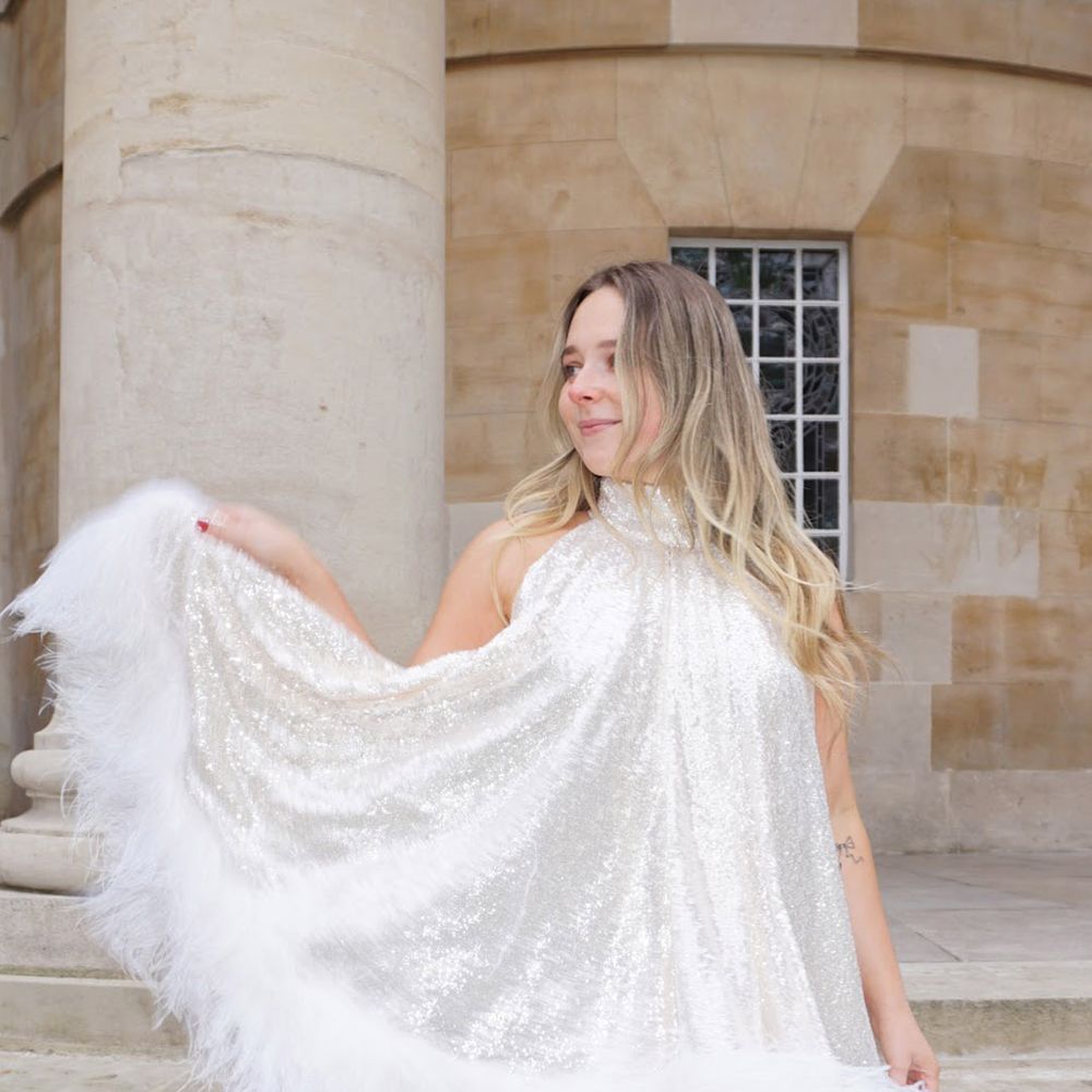 by rotation sparkly, feather-trimmed party rented wedding dress from 16 Arlington