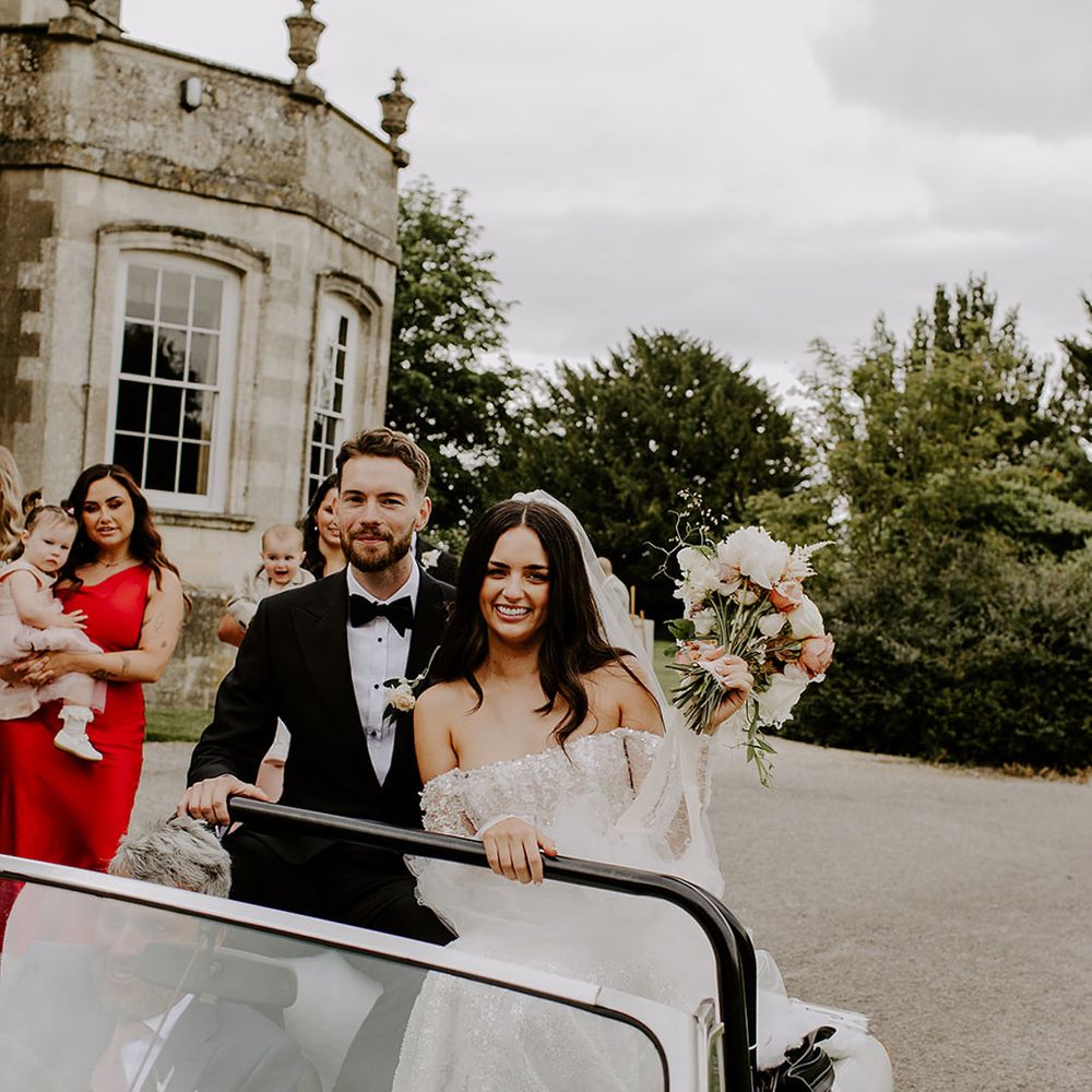 bride-and-groom-riding-in-wedding-car