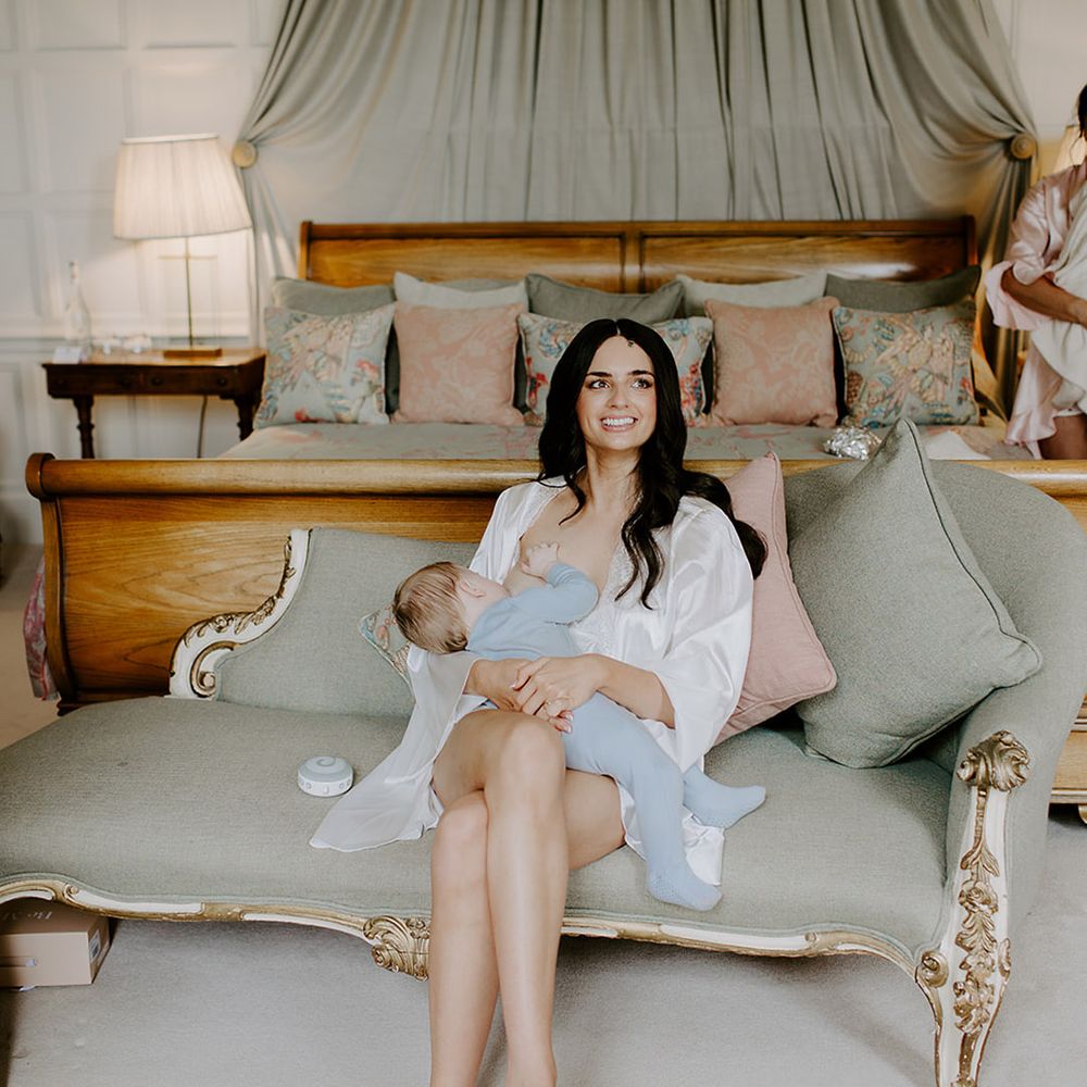bride-breastfeeds-baby-on-wedding-day