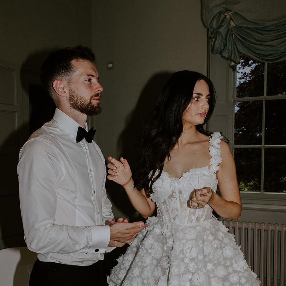 bride-in-short-floral-wedding-reception-dress-with-groom