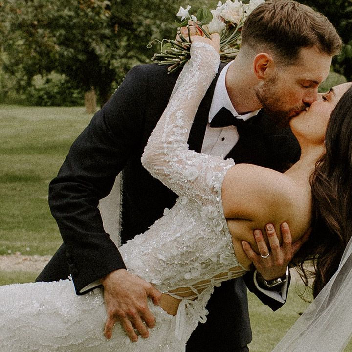 bride-kissing-groom-in-romantic-wedding-photo