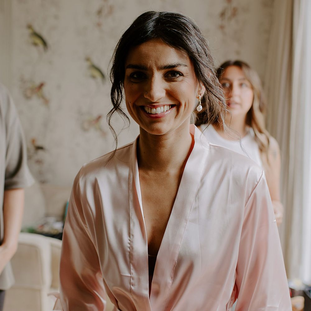 bride-wearing-pink-satin-robe