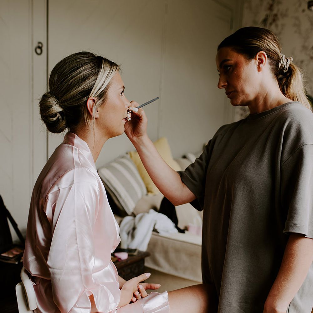 bridesmaid-gets-makeup-done-for-wedding