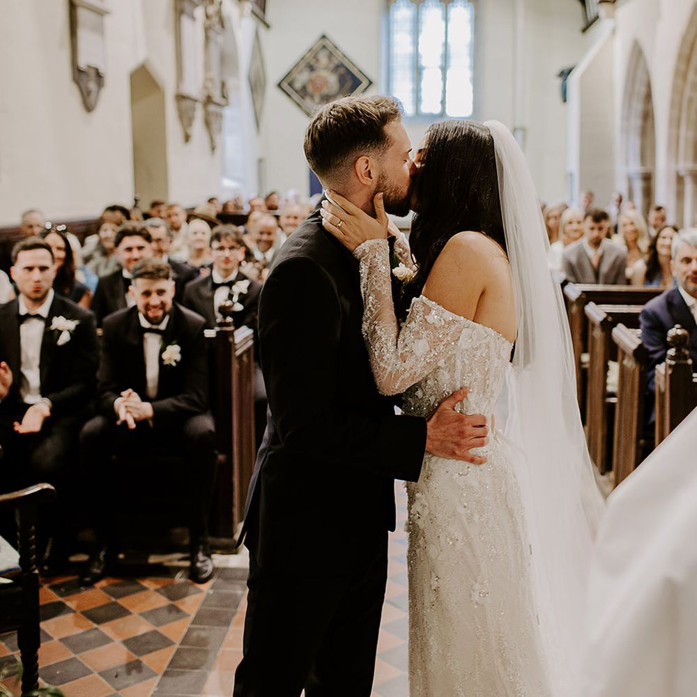 first-kiss-for-bride-and-groom-as-married-couple