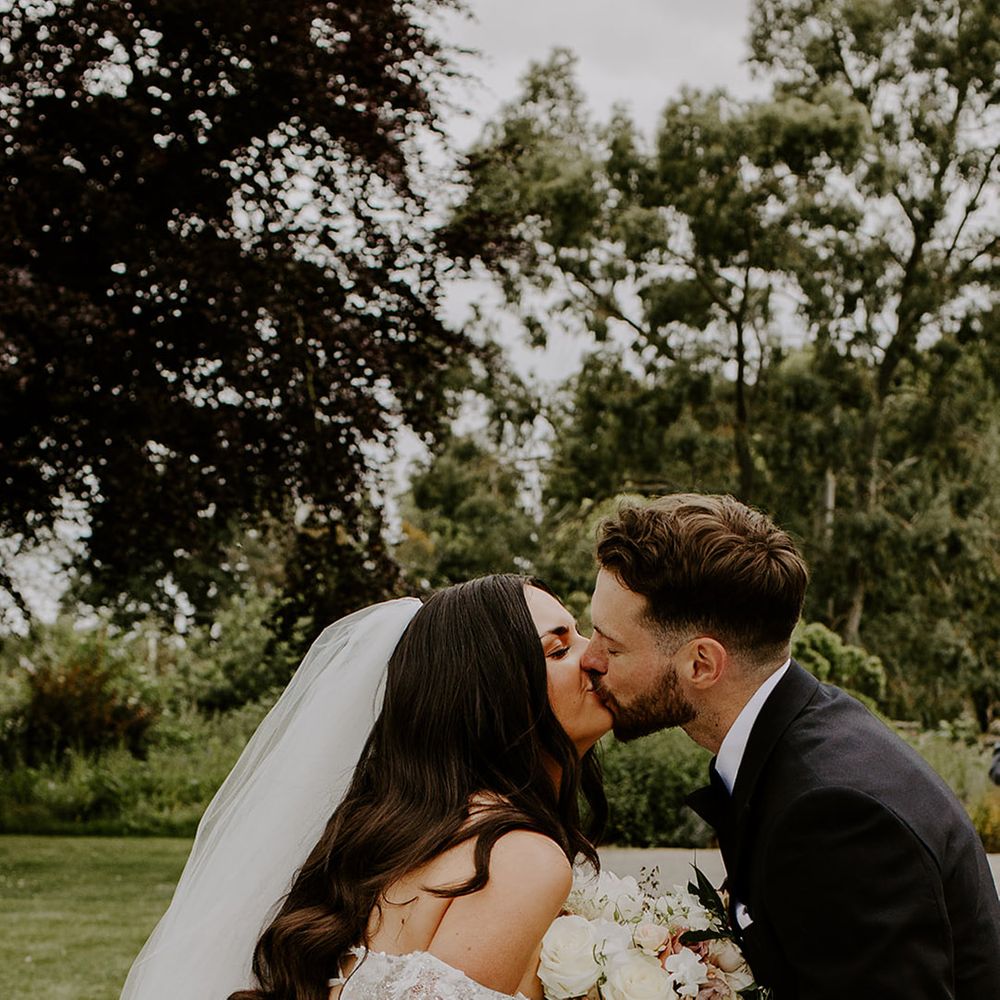 kiss-shared-between-bride-and-groom