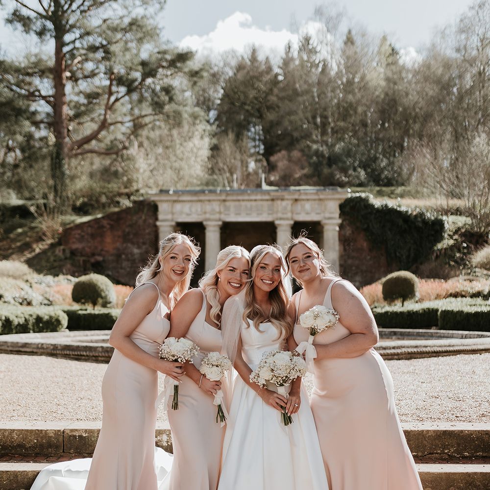 bridal-party-wearing-light-pink-bridesmaid-dresses
