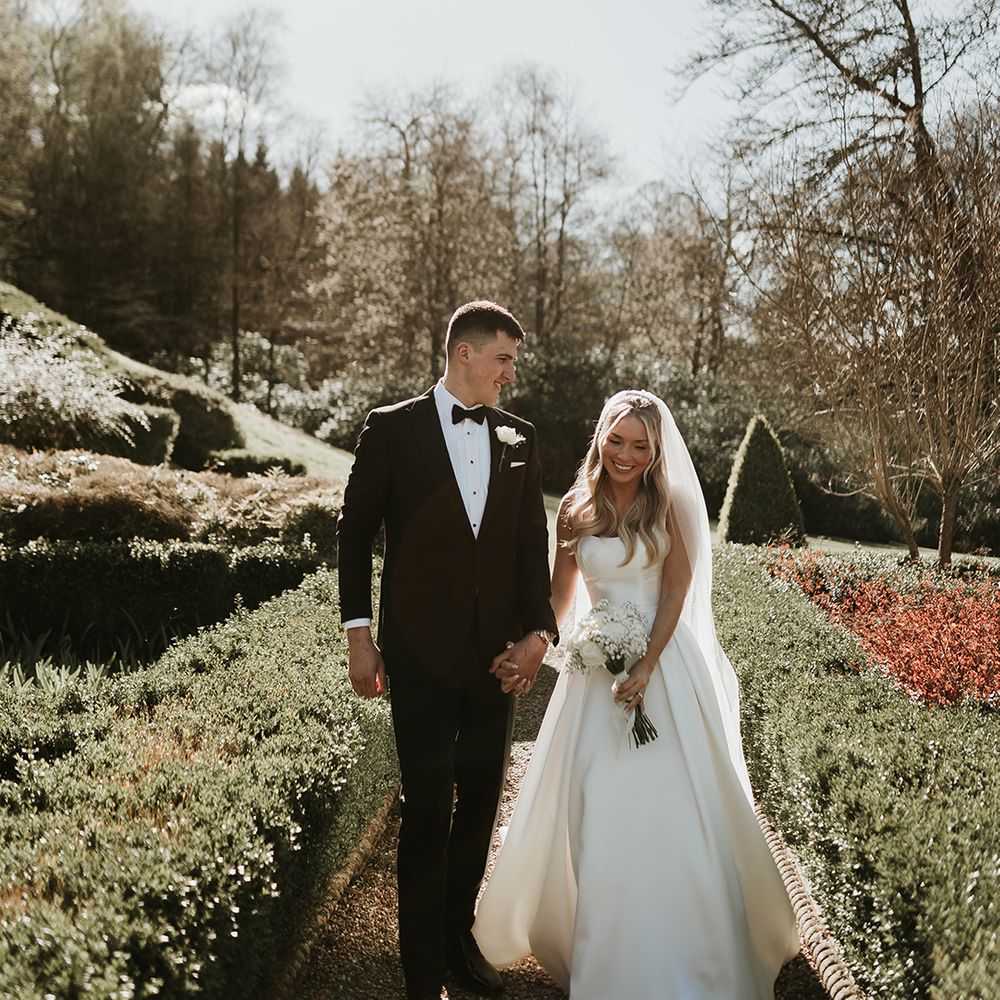 bride-and-groom-walking-hand-in-hand