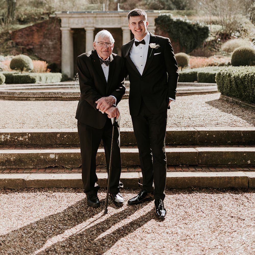 groom-with-grandad-at-wedding-day-in-black-tuxedo