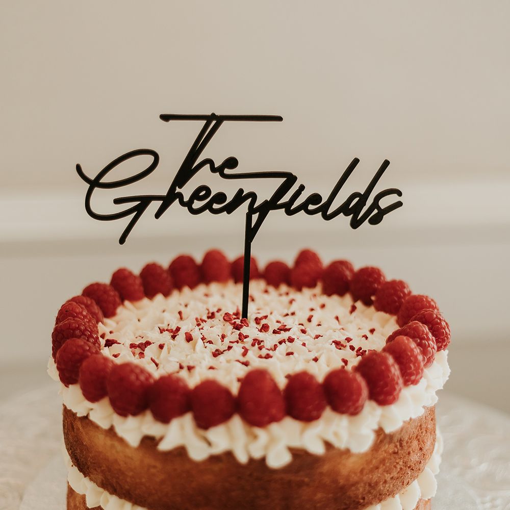 naked-wedding-cake-with-berries-and-cake-topper