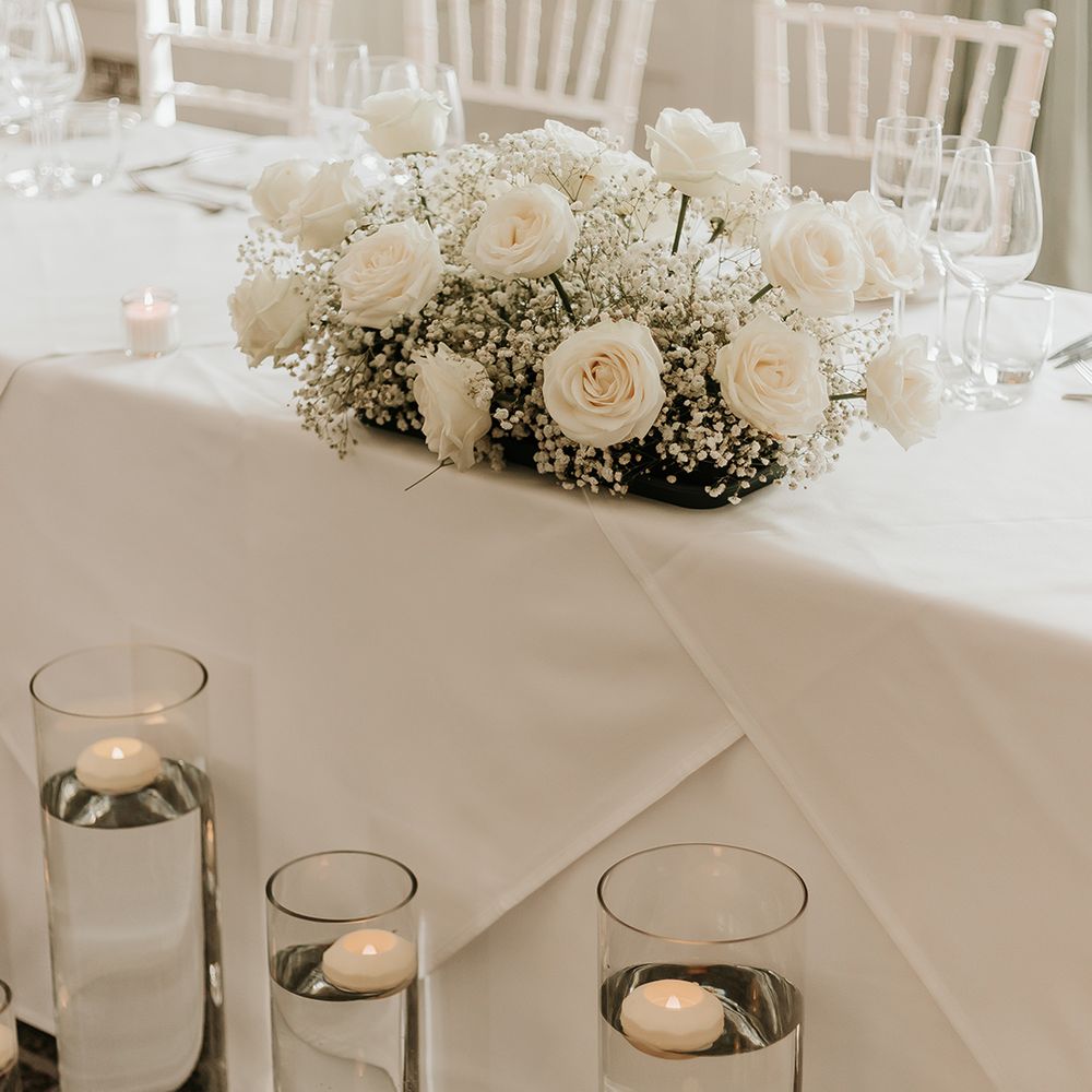 white-rose-and-gypsophila-wedding-table-centrepiece
