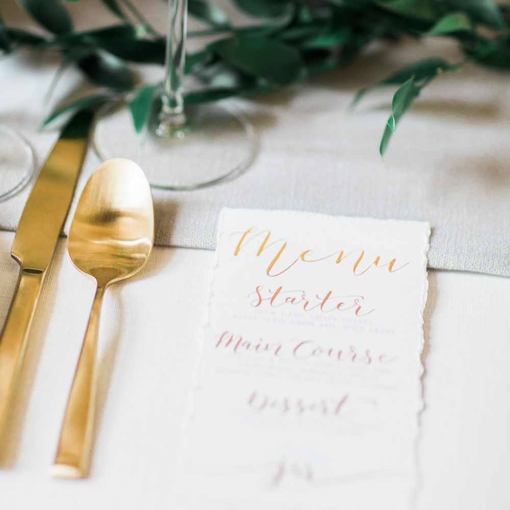 Elegant Place Setting With Gold Cutlery & Foliage Table Runner