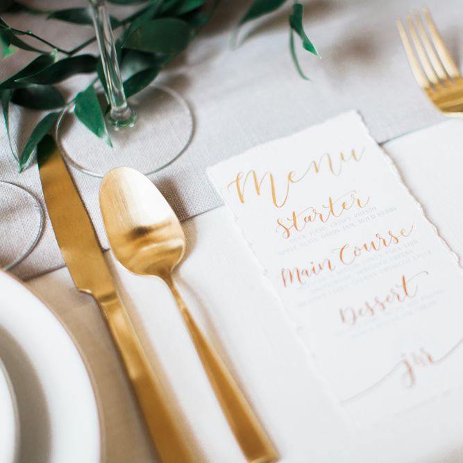 Elegant Place Setting With Gold Cutlery & Foliage Table Runner