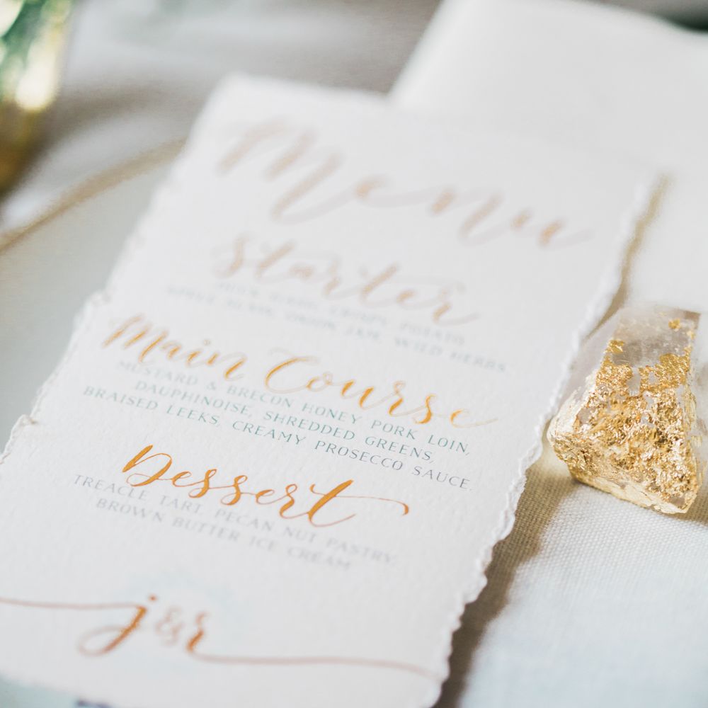 Elegant Place Setting With Gold Cutlery & Foliage Table Runner